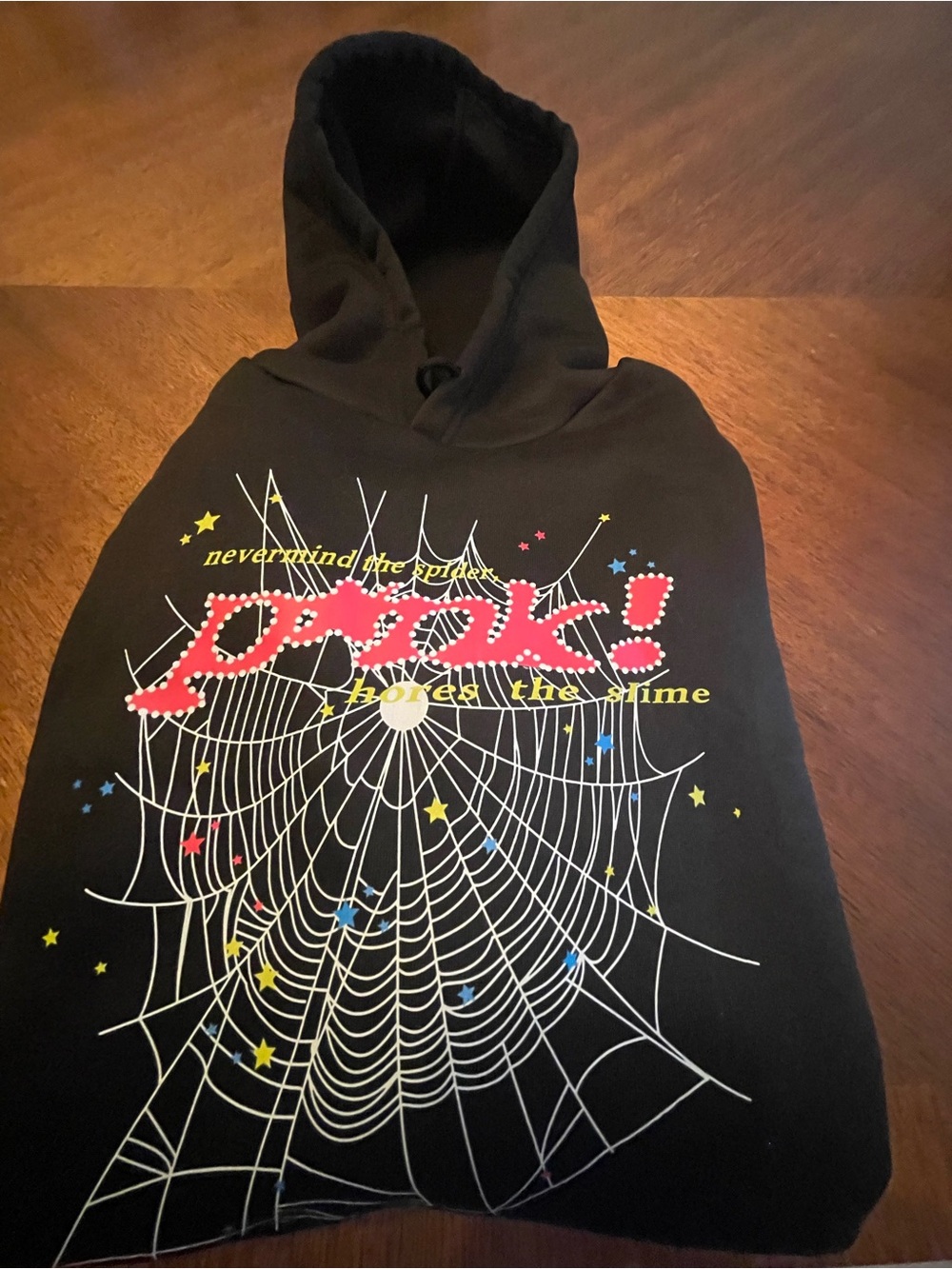 Black Graphic Hoodie with Pink "Peek!" and White Spiderweb Design